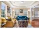 Bright living room with tray ceiling, neutral walls, hardwood floors, and stylish modern furniture at 2129 Glade Valley Ln, Morrisville, NC 27560