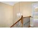 Elegant staircase features decorative wrought iron railings and a stylish chandelier at 2129 Glade Valley Ln, Morrisville, NC 27560
