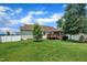 Expansive backyard with a lush lawn, mature trees, privacy fence, and deck perfect for outdoor entertaining at 22 Evie Dr, Smithfield, NC 27577