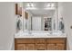 Spacious bathroom with double sink vanity, a large mirror, and well organized closet at 22 Evie Dr, Smithfield, NC 27577