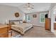 Spacious main bedroom features vaulted ceilings, ceiling fan, and two windows at 22 Evie Dr, Smithfield, NC 27577