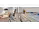 Bright bedroom featuring neutral walls and a work area with a comfortable office chair at 22 Evie Dr, Smithfield, NC 27577