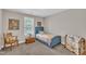 Cozy bedroom featuring neutral walls and a blue bed frame at 22 Evie Dr, Smithfield, NC 27577