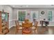Cozy dining room with wood table, chairs, and cabinets at 22 Evie Dr, Smithfield, NC 27577