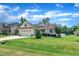 Charming one-story home with manicured lawn, American flag, and attached two-car garage at 22 Evie Dr, Smithfield, NC 27577