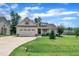 Charming one-story home featuring a well-manicured lawn and two-car attached garage at 22 Evie Dr, Smithfield, NC 27577