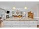 Open-concept kitchen with island that flows into the living room with fireplace at 22 Evie Dr, Smithfield, NC 27577