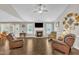 Spacious living room featuring a fireplace, ceiling fan, and hardwood floors at 22 Evie Dr, Smithfield, NC 27577