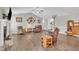 Open-concept living room with hardwood floors, fireplace, and plenty of natural light at 22 Evie Dr, Smithfield, NC 27577