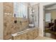 Accessible walk-in shower equipped with safety features like grab bars and a shower seat at 23 Northern Way Ct, Durham, NC 27712
