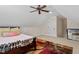 Cozy bedroom featuring a ceiling fan, a neutral color scheme, and a window with natural light at 23 Northern Way Ct, Durham, NC 27712