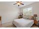 This bedroom features neutral walls, carpet flooring, a queen bed, and a window for natural light at 23 Northern Way Ct, Durham, NC 27712