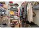 Spacious walk-in closet providing ample storage with shelving and hanging space for clothes and accessories at 23 Northern Way Ct, Durham, NC 27712