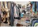 Walk-in closet with ample hanging space for clothing and a variety of storage options at 23 Northern Way Ct, Durham, NC 27712