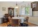 Charming dining space with hardwood floors, natural light, and elegant furnishings at 23 Northern Way Ct, Durham, NC 27712