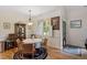 Cozy dining area features hardwood floors, a round table, and built-in display cabinet at 23 Northern Way Ct, Durham, NC 27712