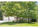 Charming home with stone accents, a two-car garage, and accessible ramp at 23 Northern Way Ct, Durham, NC 27712