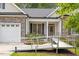 Inviting home entrance with accessible ramp and cozy seating area at 23 Northern Way Ct, Durham, NC 27712
