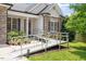 Inviting entrance to home with accessible ramp, stone accents and shaded porch at 23 Northern Way Ct, Durham, NC 27712