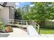 Home entrance with accessible ramp and lush, manicured greenery at 23 Northern Way Ct, Durham, NC 27712