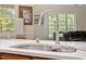 Close-up on eat-in kitchen stainless faucet and bright countertops at 23 Northern Way Ct, Durham, NC 27712
