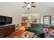 This living room offers natural light, hardwood floors, and a glimpse into the kitchen and dining areas at 23 Northern Way Ct, Durham, NC 27712