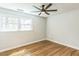 Bedroom featuring wood flooring, two windows, and neutral walls for a relaxing atmosphere at 2300 Radius Cir, Sanford, NC 27330