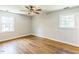 Bedroom featuring wood flooring, two windows, and neutral walls for a relaxing atmosphere at 2300 Radius Cir, Sanford, NC 27330