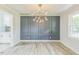 Bright dining room featuring modern wainscoting and updated lighting at 2300 Radius Cir, Sanford, NC 27330