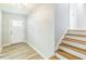 Bright foyer with updated laminate flooring and stairway at 2300 Radius Cir, Sanford, NC 27330