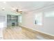 Open living room with custom built-ins, recessed lights, neutral paint, and hardwood floors at 2300 Radius Cir, Sanford, NC 27330