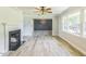 Open concept living room featuring a fireplace, neutral walls, and hardwood floors at 2300 Radius Cir, Sanford, NC 27330