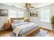 Comfortable main bedroom with hardwood floors, windows, and a wooden bed frame at 2300 Radius Cir, Sanford, NC 27330