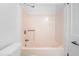 Bathroom featuring a classic bathtub with tile surround at 235 Mccauley St # D, Chapel Hill, NC 27516