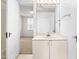 Bright bathroom featuring a single sink vanity and white cabinets at 235 Mccauley St # D, Chapel Hill, NC 27516