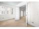 Bright bedroom with exposed brick wall, natural light, and neutral carpet provides a serene and comfortable retreat at 235 Mccauley St # D, Chapel Hill, NC 27516