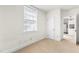 Bright bedroom with a window and neutral walls at 235 Mccauley St # D, Chapel Hill, NC 27516