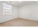 Bright bedroom with a window and neutral walls at 235 Mccauley St # D, Chapel Hill, NC 27516