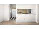 Bright, open living room showcasing a kitchen area with modern appliances at 235 Mccauley St # D, Chapel Hill, NC 27516