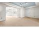 Bright, airy living room featuring neutral carpet, soft blue ceiling, and natural light providing a welcoming atmosphere at 235 Mccauley St # D, Chapel Hill, NC 27516