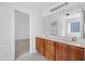 Bathroom featuring double sink vanity, tile flooring, and a view into the bedroom at 238 Royal Tower Way, Cary, NC 27513