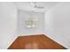Simple and clean bedroom featuring hardwood floors and a bright window, perfect for customization at 238 Royal Tower Way, Cary, NC 27513
