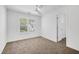 Bedroom showcasing a modern ceiling fan, window, and neutral carpeting at 238 Royal Tower Way, Cary, NC 27513