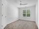 Well lit bedroom with a ceiling fan, carpeted floors, and a large window at 238 Royal Tower Way, Cary, NC 27513