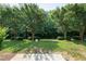 Serene community green space featuring mature trees and well-maintained landscaping, perfect for relaxation and recreation at 238 Royal Tower Way, Cary, NC 27513