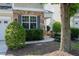 A welcoming entrance featuring attractive stone accents, a covered porch, and lush landscaping creating great curb appeal at 238 Royal Tower Way, Cary, NC 27513