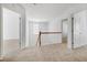 Spacious upstairs hallway with carpet flooring and natural light at 238 Royal Tower Way, Cary, NC 27513