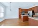 Spacious kitchen with wooden cabinets, stainless steel appliances, and an island for ample workspace at 238 Royal Tower Way, Cary, NC 27513