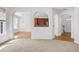 Inviting living area showcases arched entryways leading to a bright kitchen and hallway, offering open connectivity at 238 Royal Tower Way, Cary, NC 27513