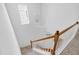 Bright staircase featuring natural light, wood railings and carpeted steps at 238 Royal Tower Way, Cary, NC 27513